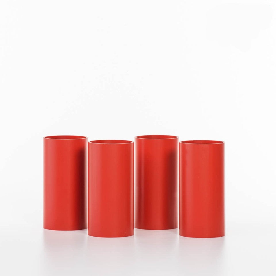 A set of four red cylindrical stack rolls for the game Rolla Bolla, displayed against a white background.