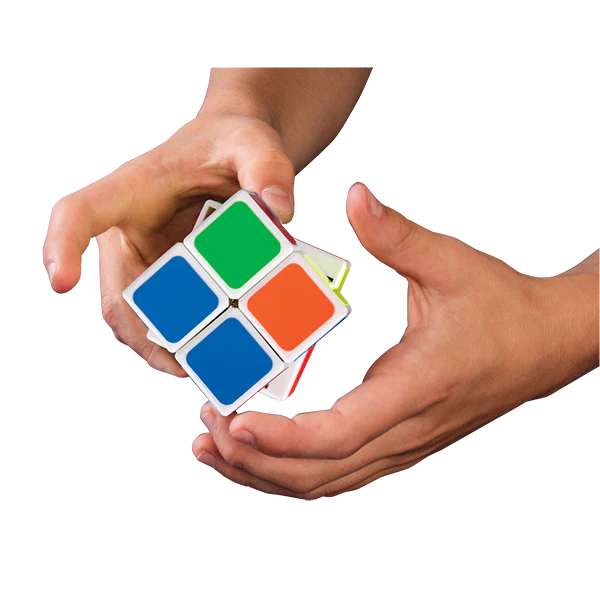 Quick cube being solved by two hands on a white background