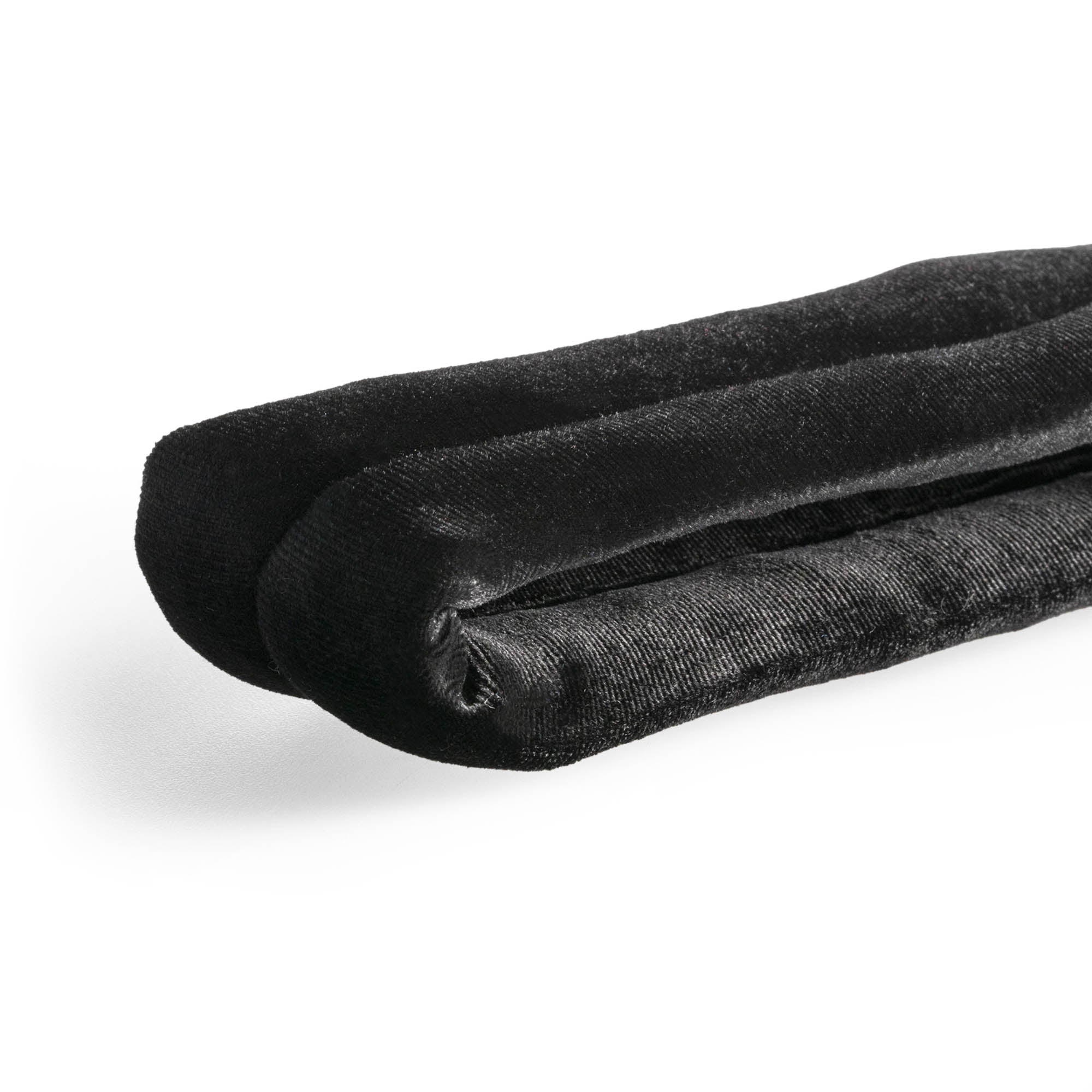 Black velvet hand loop close up texture flat