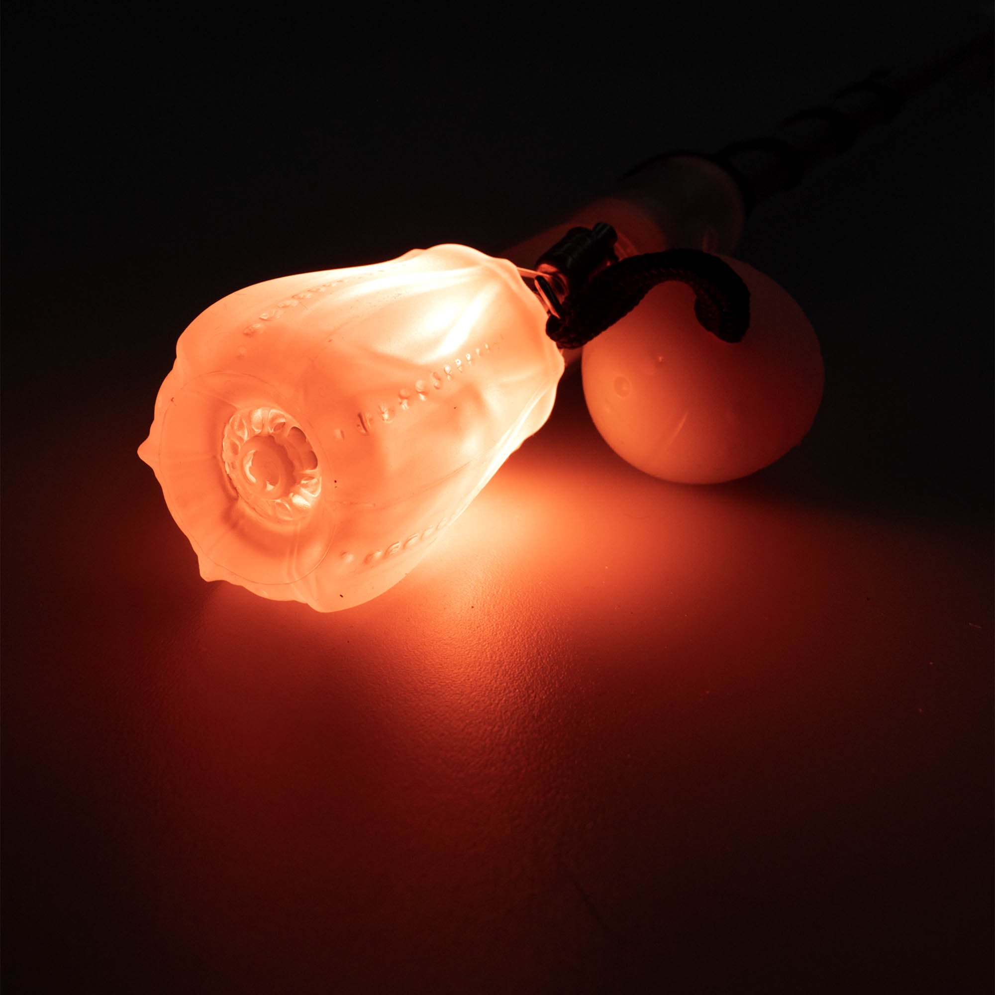 Flowtoys composite contact wand v2 close up of wand end glowing orange