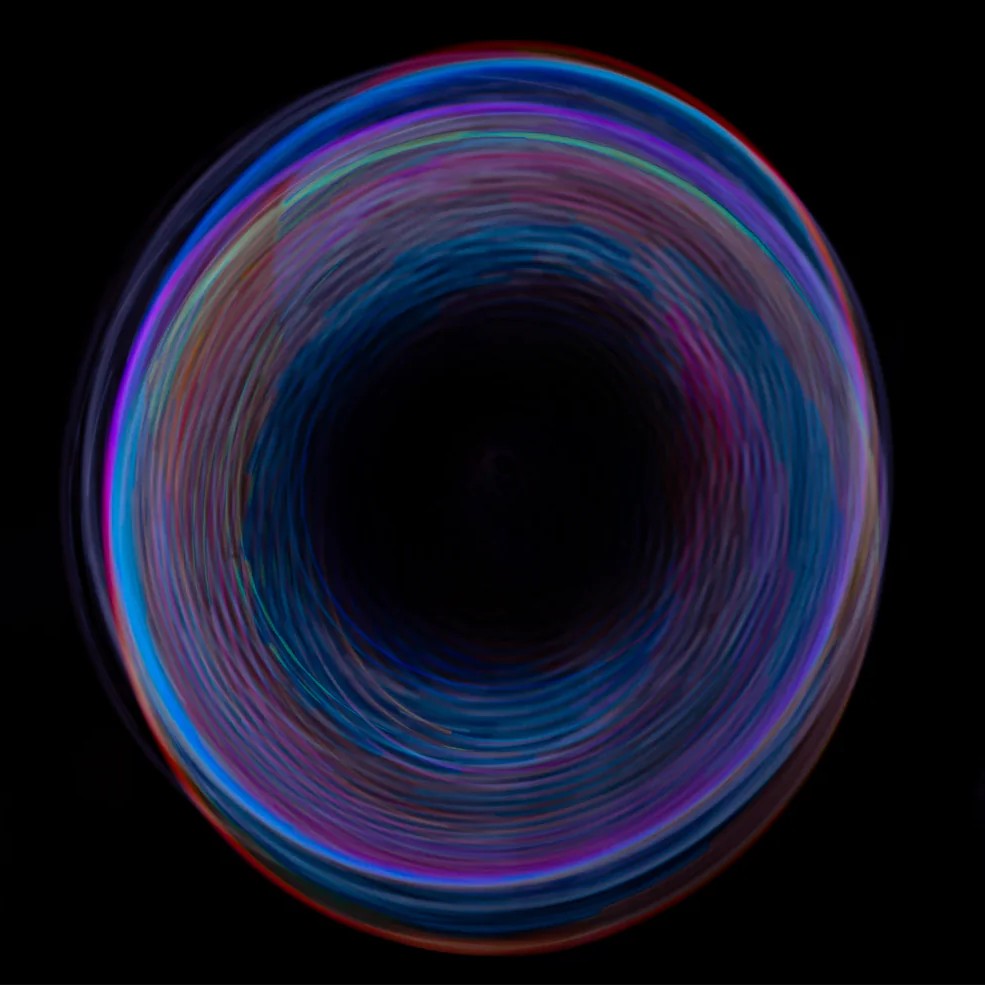 Colorful circular light effect on a black background