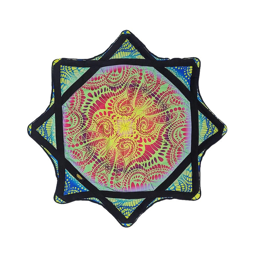 Colorful geometric spinning cloth with a vibrant pattern on a white background