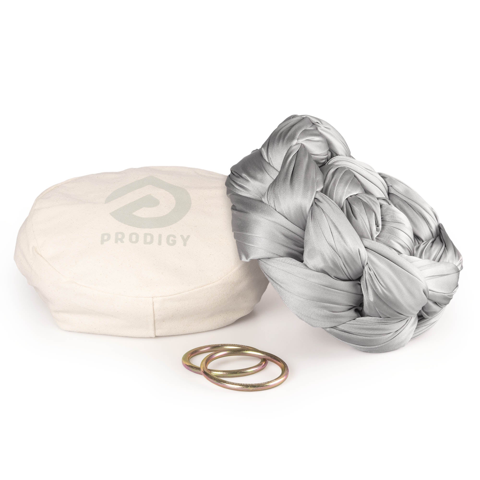 Silver yoga hammock resting on eco bag with O-rings laying in front