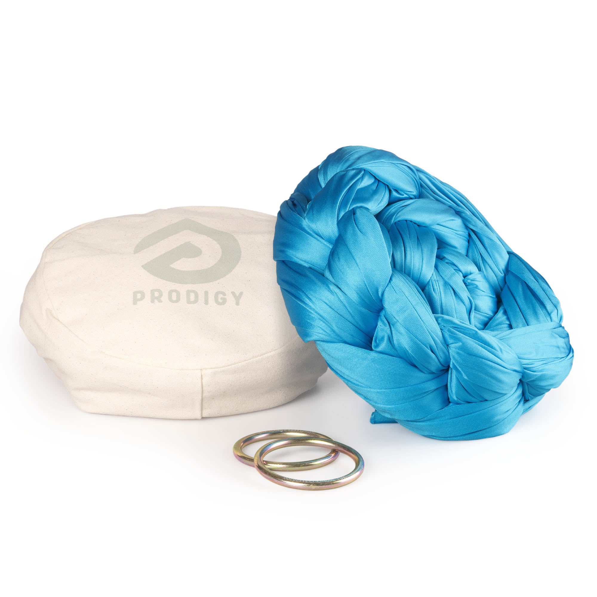 Tuquoise yoga hammock resting on eco bag with O-rings laying in front