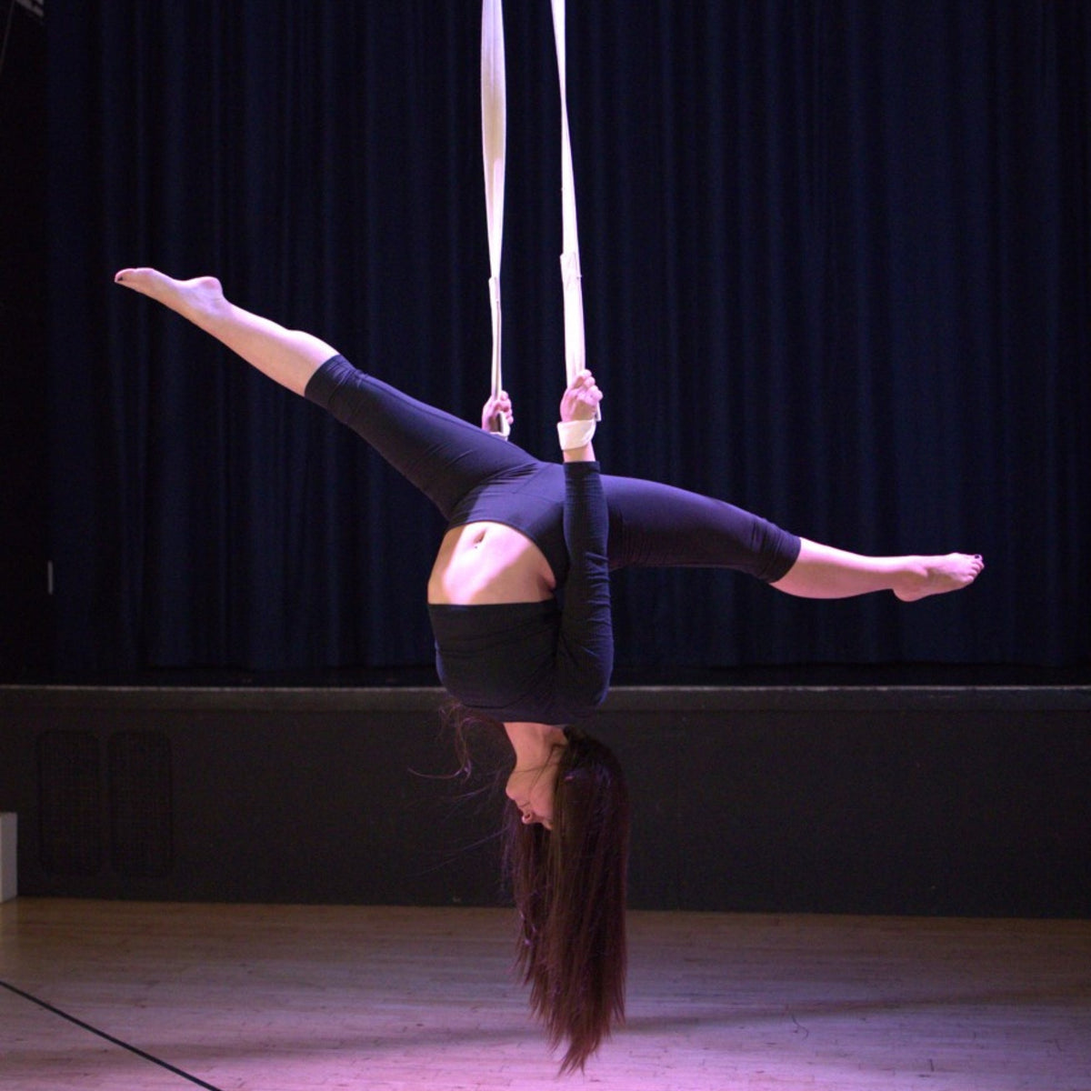 performer using cotton covered aerial straps