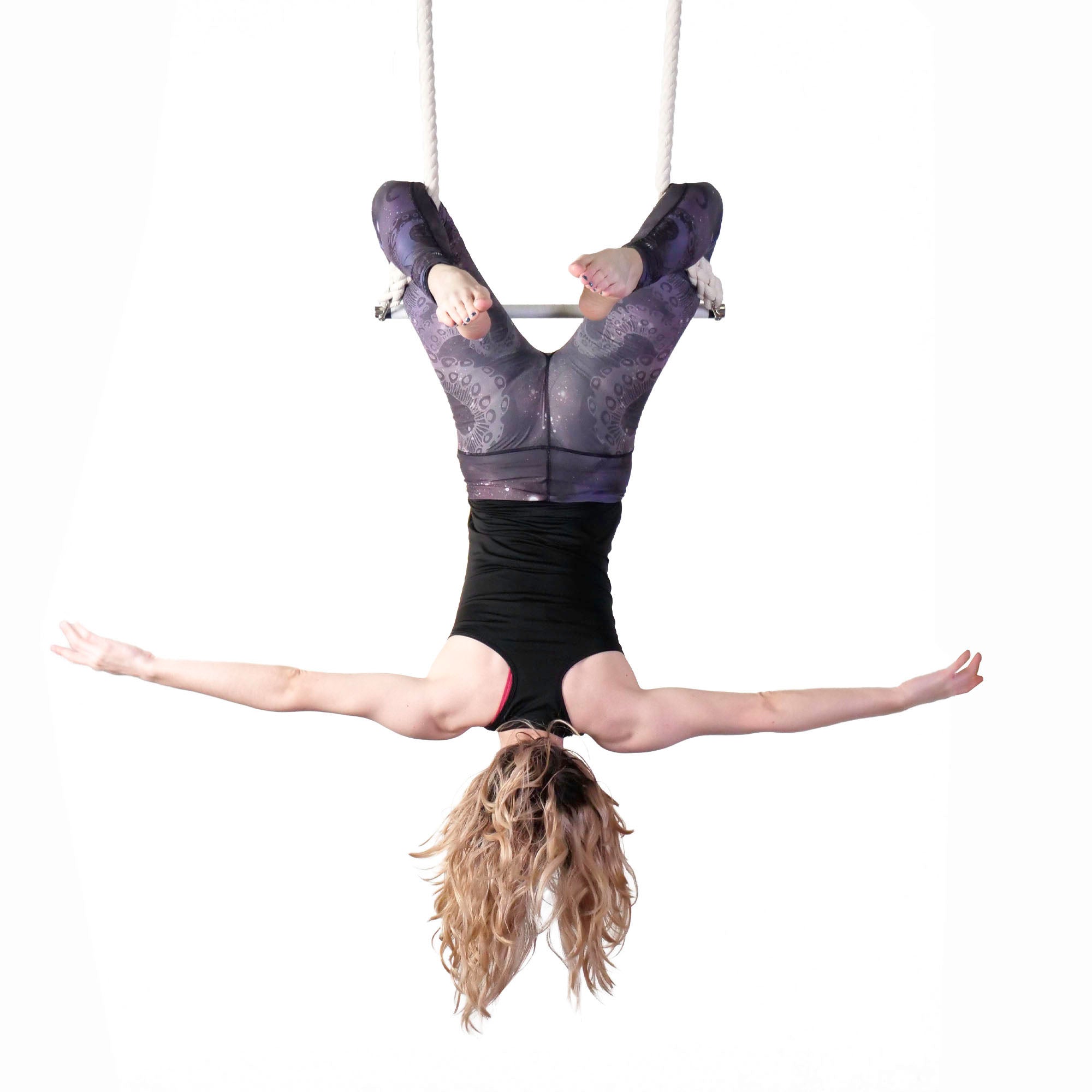 performer on shackle trapeze