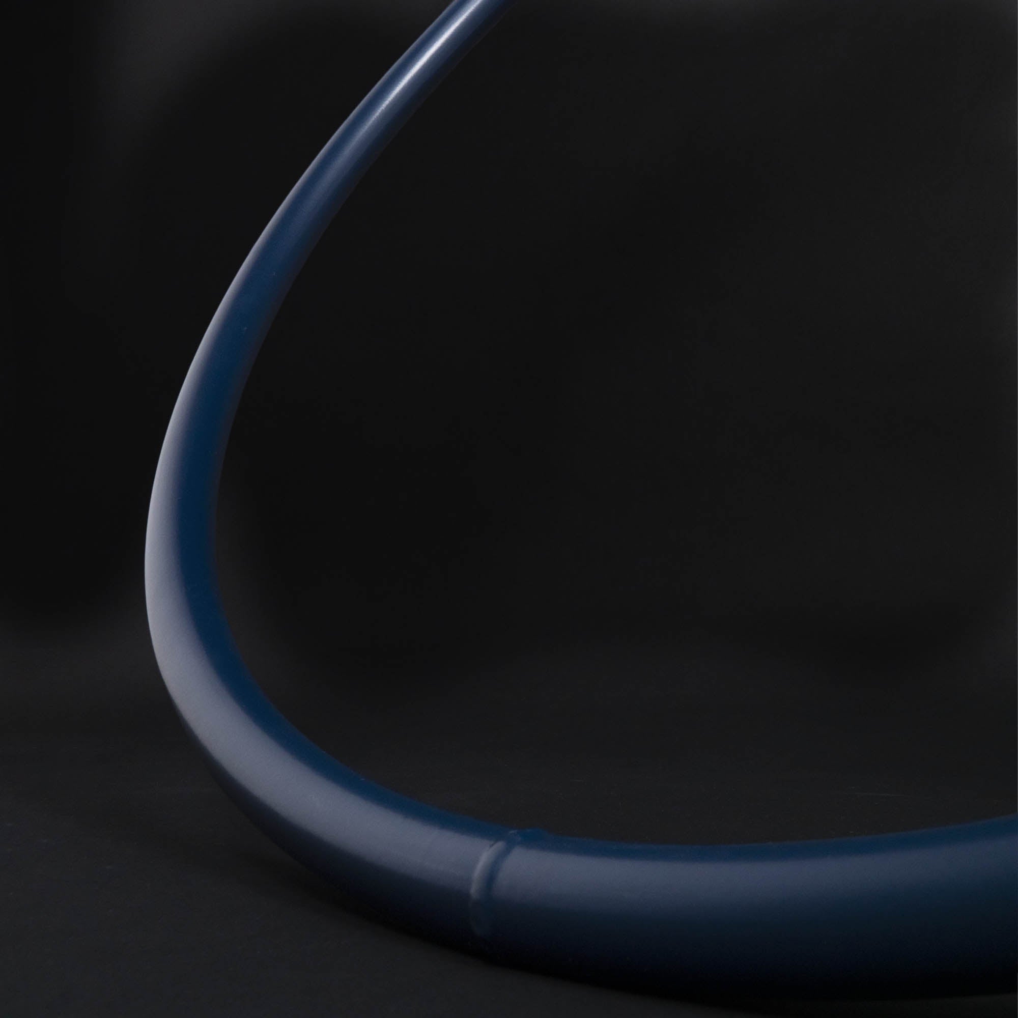 Close up of blue hoop on black background