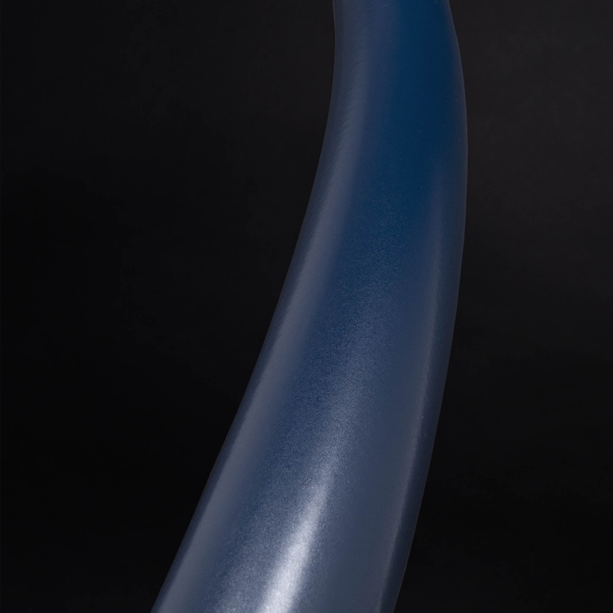 Close up of blue hoop on black background