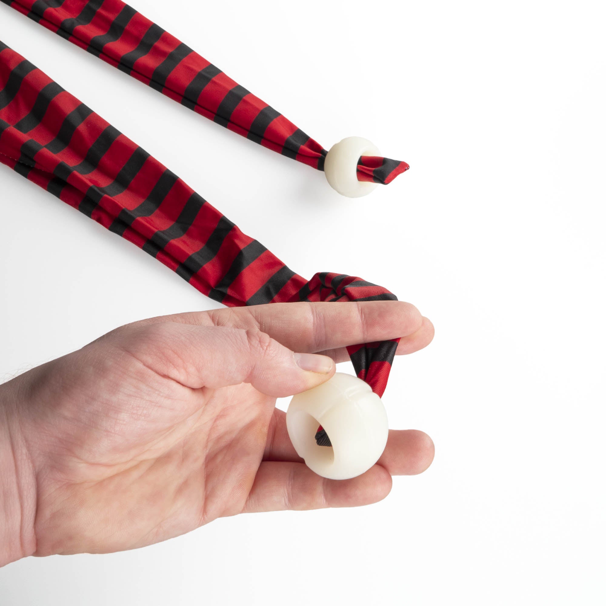 Status stretchy sock poi close up of silicone handles in hand