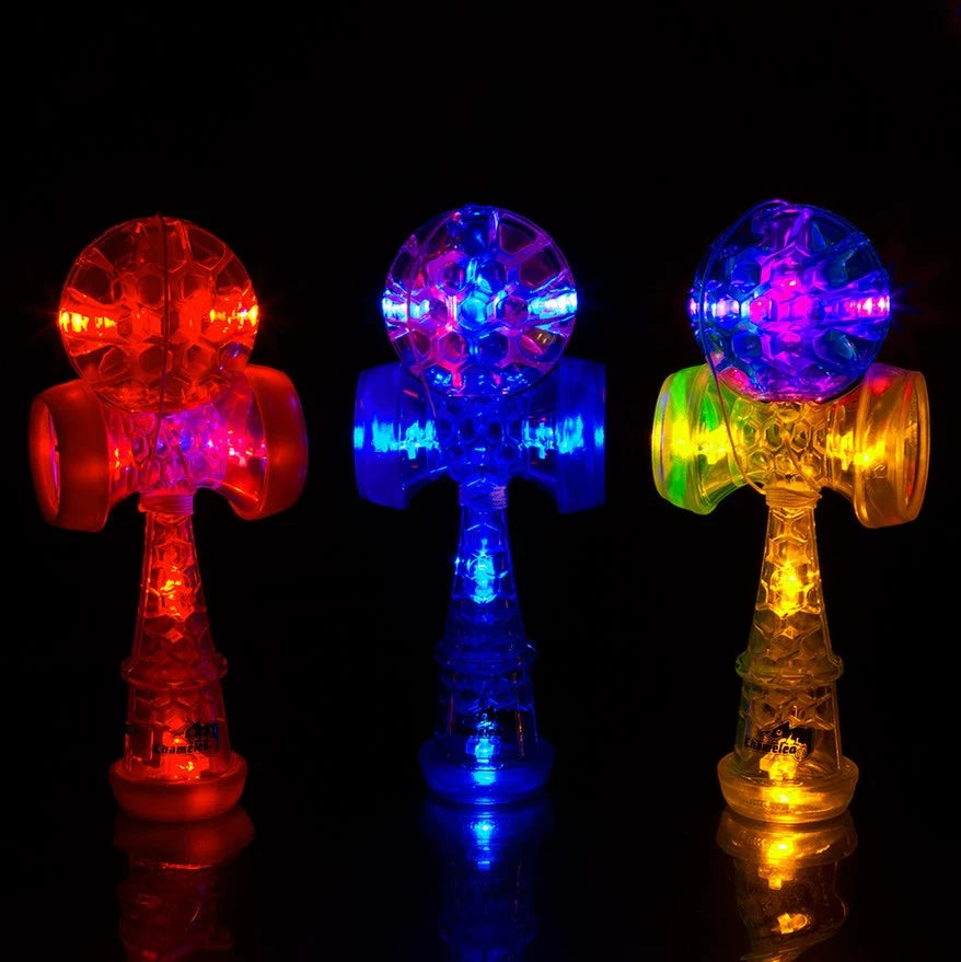 Three duncan torch diabolos, glowing in various colours