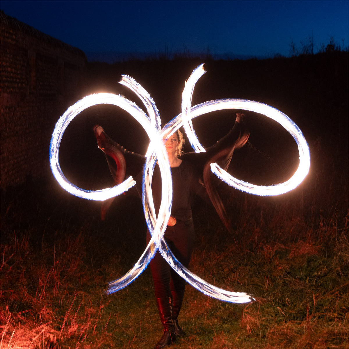 performer with fire poi