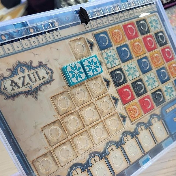 Board game 'Azul' with tiles and a scoring area.