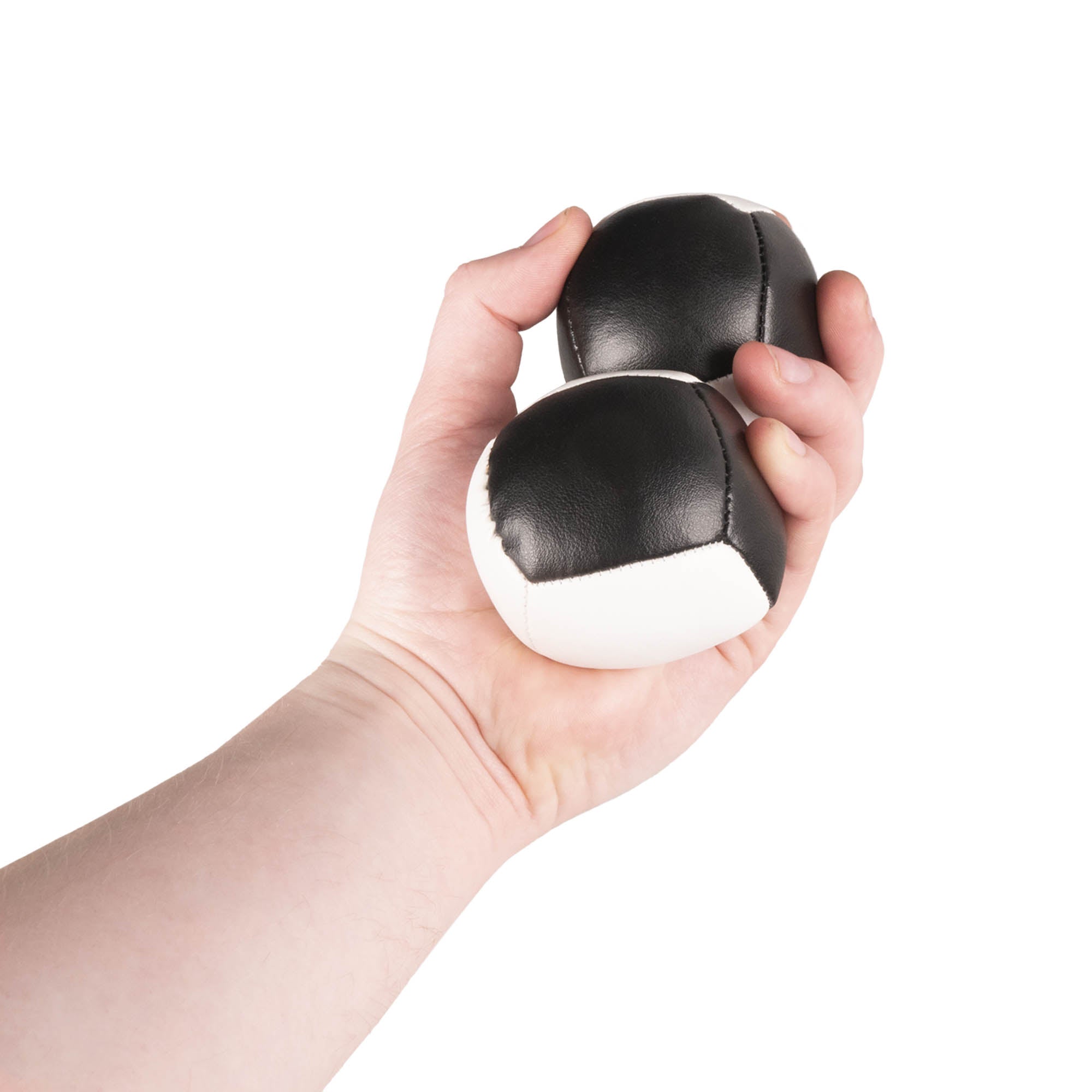 Firetoys two black/white 110g thud juggling balls in hand