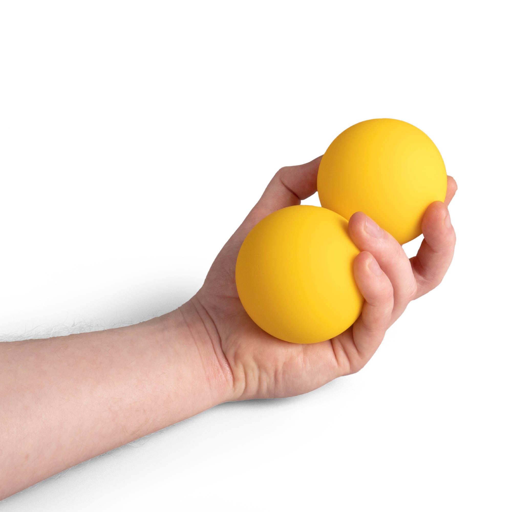 Two yellow Mr Babache russian juggling balls in hand