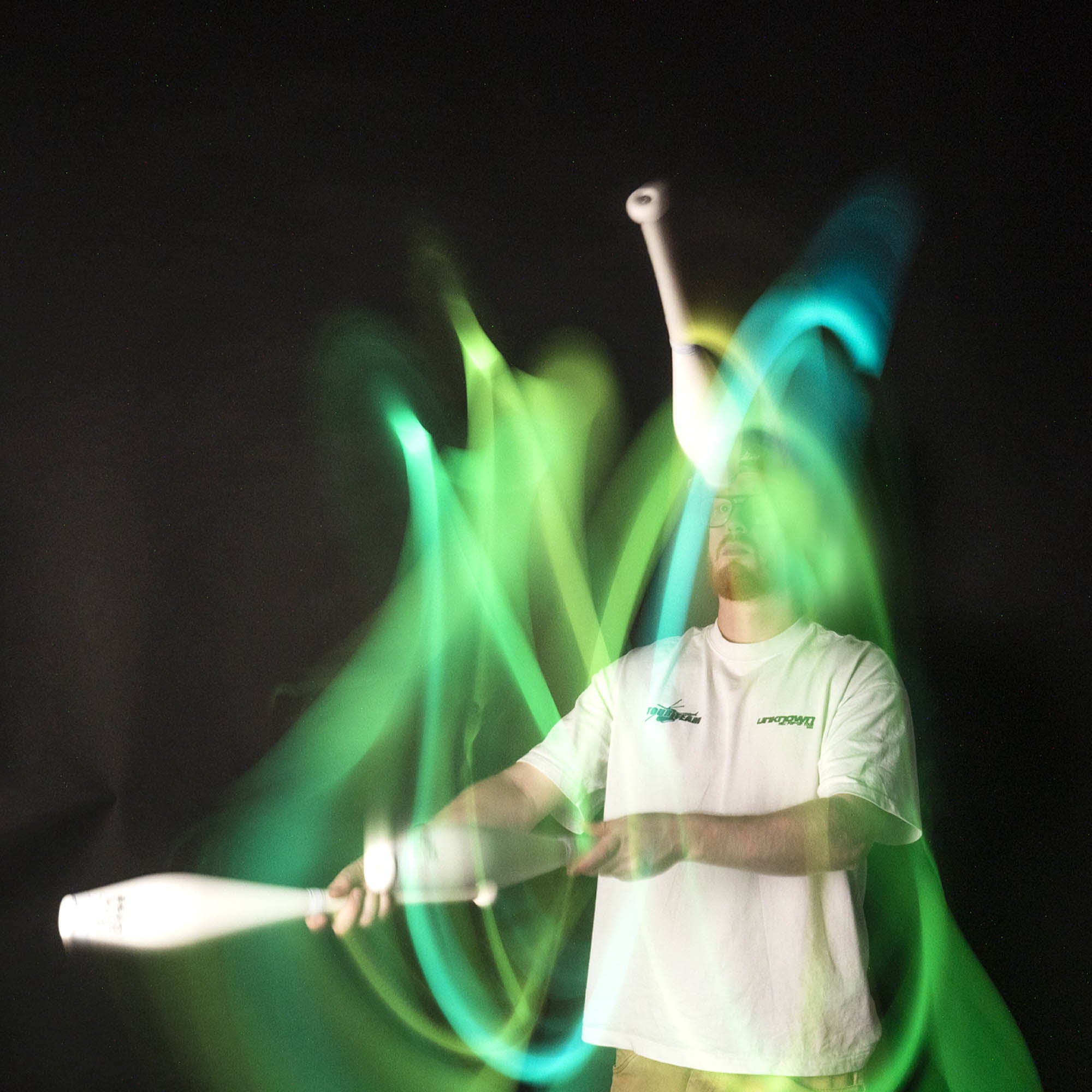Nebula 3 LED juggling club action shot glowing green