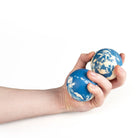 Two blue oddballs bounce ball in hand