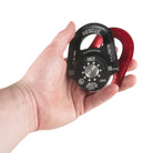 Petzl pulley rescue in red / black in hand