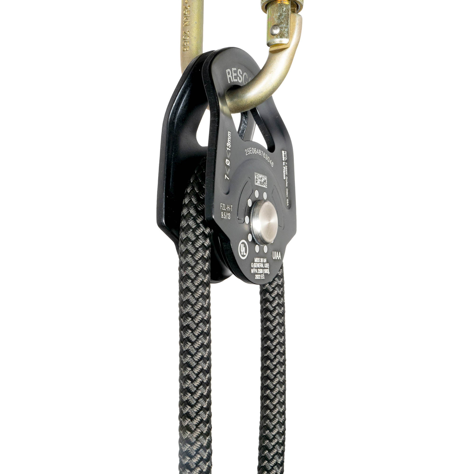 Petzl rescue pulley in black attached to carabiner at angle