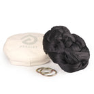 Black Aerial Sling resting on eco bag with O-rings laying in front