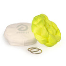 Neon yellow Aerial Sling resting on eco bag with O-rings laying in front