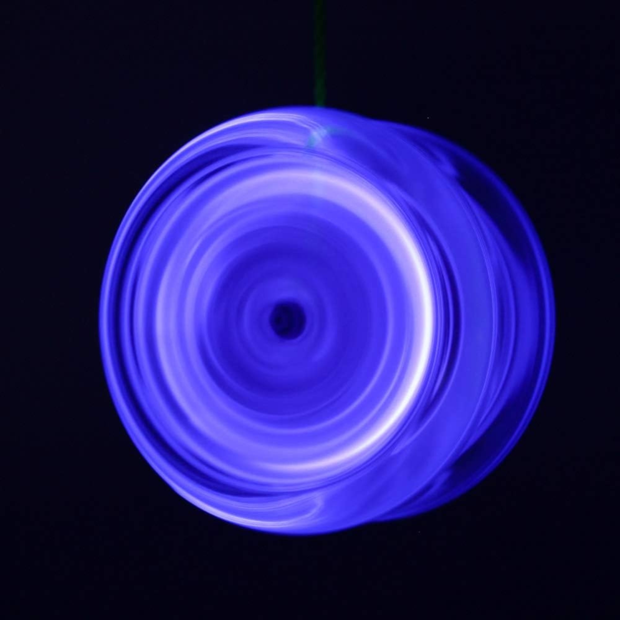 glowing blue yoyo spinning
